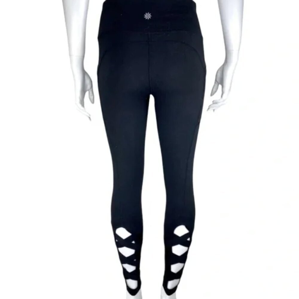 Athleta black leggings cutout elastic bottoms with pockets - size XS
